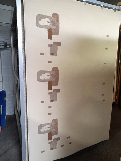 Jasnobeżowy dywan wełniany